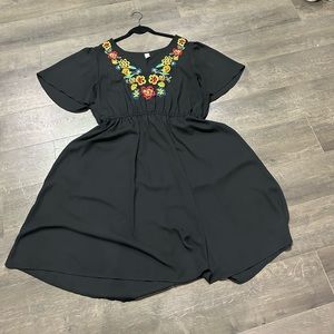 Beautiful black dress with floral design at top